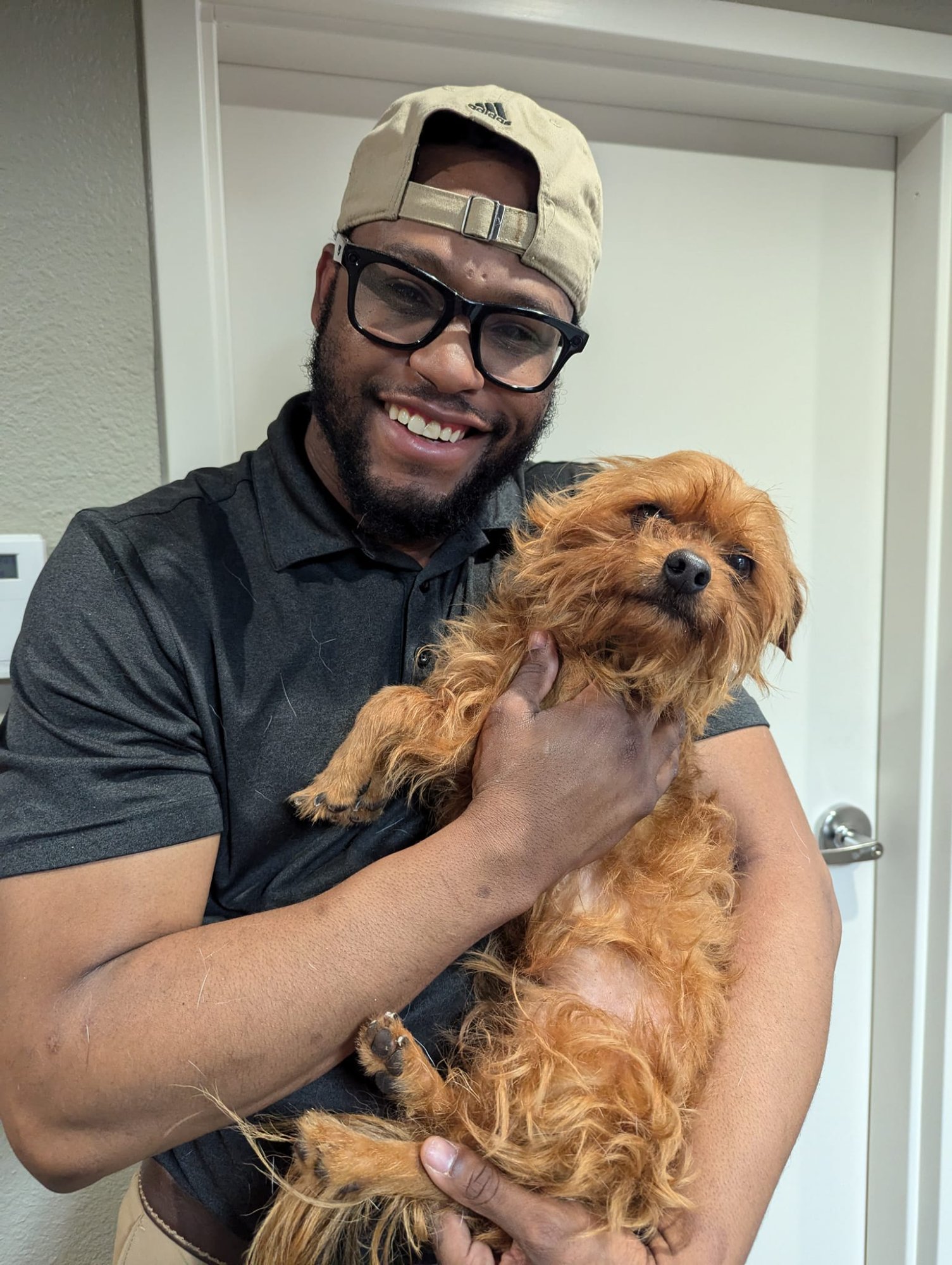Kameron with yorkie during house call
